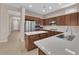 Well-appointed kitchen with quartz countertops, stainless steel appliances, and central island at 11237 Newbury Hills Ave, Las Vegas, NV 89138