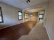 Bright living room with hardwood floors, neutral tones, and an open layout flowing into other living spaces at 11237 Newbury Hills Ave, Las Vegas, NV 89138