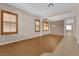Spacious living room featuring beautiful wood floors, shuttered windows, and neutral paint tones at 11237 Newbury Hills Ave, Las Vegas, NV 89138