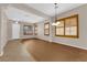Open-concept living room featuring wood floors, and neutral paint tones at 11237 Newbury Hills Ave, Las Vegas, NV 89138