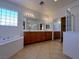 Luxurious main bathroom with double vanities, a soaking tub, and a glass-enclosed shower for spa-like experience at 11237 Newbury Hills Ave, Las Vegas, NV 89138