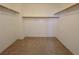 Spacious walk-in closet features ample storage with built-in shelving and neutral carpeting at 11237 Newbury Hills Ave, Las Vegas, NV 89138