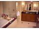 Luxurious bathroom with soaking tub, glass shower, and elegant vanity with double sinks at 135 E Harmon Ave # 518, Las Vegas, NV 89109