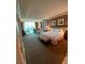Inviting bedroom with plush bedding, a sitting area, and a large window offering scenic views at 135 E Harmon Ave # 518, Las Vegas, NV 89109