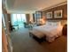 Spacious bedroom featuring a cozy seating area and a large window with scenic views at 135 E Harmon Ave # 518, Las Vegas, NV 89109