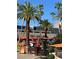 An inviting community outdoor pool with surrounding lounge areas and lush landscaping at 135 E Harmon Ave # 518, Las Vegas, NV 89109