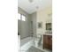Bathroom with a tub/shower combo and wood vanity at 1409 Denver St, Boulder City, NV 89005