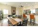 Dining area with modern table and chairs, seamlessly connected to the living area and a stylish kitchen at 1409 Denver St, Boulder City, NV 89005