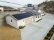 Home exterior with solar panels and a spacious driveway at 1409 Denver St, Boulder City, NV 89005