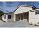 Stylish home features a porte-cochere with stone accents and drought tolerant landscaping at 1409 Denver St, Boulder City, NV 89005