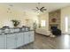 Stylish open-concept kitchen and living area featuring a granite island and stone fireplace at 1409 Denver St, Boulder City, NV 89005