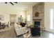 Inviting living room with a floor-to-ceiling stone fireplace, light yellow walls, and elegant decor at 1409 Denver St, Boulder City, NV 89005