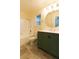 Bright bathroom featuring tiled floor, vanity and a tub with shower at 1440 Rawhide Rd, Boulder City, NV 89005