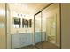 Well-lit double vanity bathroom with mirrored closet and separate toilet and shower at 1440 Rawhide Rd, Boulder City, NV 89005