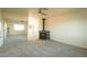 Bedroom with carpet, ceiling fan, full mirror closet and a black fireplace at 1440 Rawhide Rd, Boulder City, NV 89005