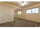 Bright bedroom featuring a closet with mirrored doors and exterior view at 1440 Rawhide Rd, Boulder City, NV 89005