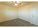 Bedroom with neutral carpet, a ceiling fan, and a white door at 1440 Rawhide Rd, Boulder City, NV 89005
