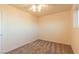 Carpeted bedroom showcasing a ceiling fan and a window at 1440 Rawhide Rd, Boulder City, NV 89005