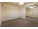 The bedroom includes a mirrored closet, carpet, and a ceiling fan at 1440 Rawhide Rd, Boulder City, NV 89005