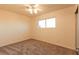 Bedroom featuring neutral carpet, a window, and a ceiling fan at 1440 Rawhide Rd, Boulder City, NV 89005