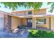 Charming home featuring stone accents, a gray garage door and neat landscaping at 1440 Rawhide Rd, Boulder City, NV 89005
