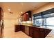Bright kitchen featuring granite countertops, stainless steel appliances, and outdoor views at 1440 Rawhide Rd, Boulder City, NV 89005