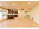 Bright and open living room featuring tile floors, french doors, and seamless kitchen access at 1440 Rawhide Rd, Boulder City, NV 89005