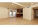 Open living area features French doors to pool, tile floors, and an adjacent kitchen area at 1440 Rawhide Rd, Boulder City, NV 89005