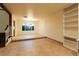 Spacious living room featuring tiled floors, a bright window, and stylish built-in shelving at 1440 Rawhide Rd, Boulder City, NV 89005