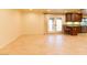 Bright living space with tile floors, French doors to the patio, and views of the kitchen bar at 1440 Rawhide Rd, Boulder City, NV 89005