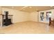 Spacious living room with a charming fireplace and access to the outdoor patio at 1440 Rawhide Rd, Boulder City, NV 89005