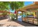 An outdoor kitchen featuring a stainless steel grill, countertop space, and ample storage, perfect for outdoor dining at 1440 Rawhide Rd, Boulder City, NV 89005