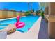 Beautiful pool featuring clear blue water and a fun flamingo floatie, perfect for enjoying outdoor fun in the sun at 1440 Rawhide Rd, Boulder City, NV 89005