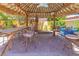 Charming tiki bar featuring seating, with an airy design, perfect for relaxing by the pool at 1440 Rawhide Rd, Boulder City, NV 89005