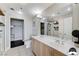 Modern bathroom with double sinks, large mirror, and separate walk-in shower and walk-in closet at 150 Las Vegas Blvd # 1118, Las Vegas, NV 89101