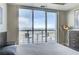 Relaxing bedroom featuring a private balcony with city views, hardwood floors and neutral wall color at 150 Las Vegas Blvd # 1118, Las Vegas, NV 89101