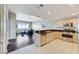 Open-concept kitchen and living room with modern appliances and hardwood floors at 150 Las Vegas Blvd # 1118, Las Vegas, NV 89101