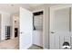 Convenient laundry room featuring a stacked washer and dryer unit, shelving, and easy access at 150 Las Vegas Blvd # 1118, Las Vegas, NV 89101