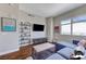 Bright living room with hardwood floors, modern shelving, and a large window offering scenic views at 150 Las Vegas Blvd # 1118, Las Vegas, NV 89101