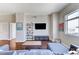 Cozy living room featuring hardwood floors, a mounted TV, and a large window at 150 Las Vegas Blvd # 1118, Las Vegas, NV 89101