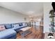Comfortable living room with an open view of the kitchen, hardwood floors and a large sectional sofa at 150 Las Vegas Blvd # 1118, Las Vegas, NV 89101