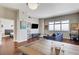 Open living area with sleek floors, a large window, and a modern entertainment setup at 150 Las Vegas Blvd # 1118, Las Vegas, NV 89101
