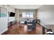 Spacious living room featuring hardwood floors, large windows, and a comfortable sectional sofa at 150 Las Vegas Blvd # 1118, Las Vegas, NV 89101