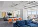 Inviting lounge area with comfortable seating, large windows offering city views, and vibrant artwork at 150 Las Vegas Blvd # 1118, Las Vegas, NV 89101