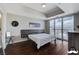 Bright main bedroom featuring a modern design, hardwood floors, and sliding glass doors with city views at 150 Las Vegas Blvd # 1118, Las Vegas, NV 89101