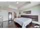 Well-lit main bedroom with hardwood floors, a floating headboard, and access to the ensuite bathroom at 150 Las Vegas Blvd # 1118, Las Vegas, NV 89101