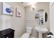 Stylish powder room featuring a pedestal sink and decorative artwork at 150 Las Vegas Blvd # 1118, Las Vegas, NV 89101