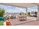 Relaxing rooftop deck boasts chic seating, outdoor dining, vibrant planters, and amazing city views at 150 Las Vegas Blvd # 1118, Las Vegas, NV 89101
