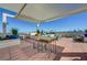 Spacious rooftop deck offers a summer kitchen, dining sets, multiple seating areas, and amazing city views at 150 Las Vegas Blvd # 1118, Las Vegas, NV 89101
