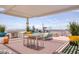 Well-appointed rooftop deck includes a built-in grill, comfortable seating, dining area, and city skyline backdrop at 150 Las Vegas Blvd # 1118, Las Vegas, NV 89101